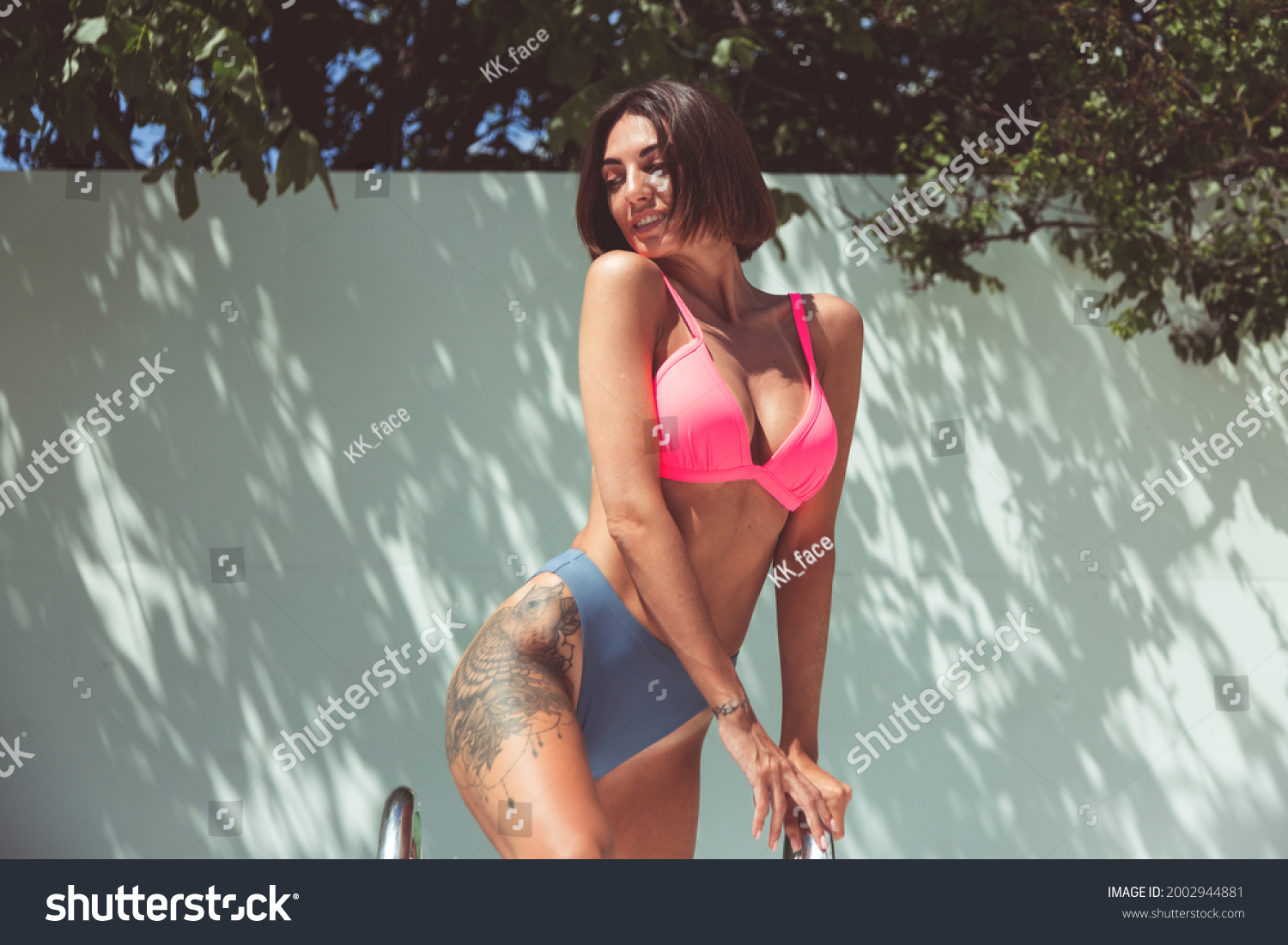 Beautiful Tanned Fit Woman Bikini Backyard Stock Photo