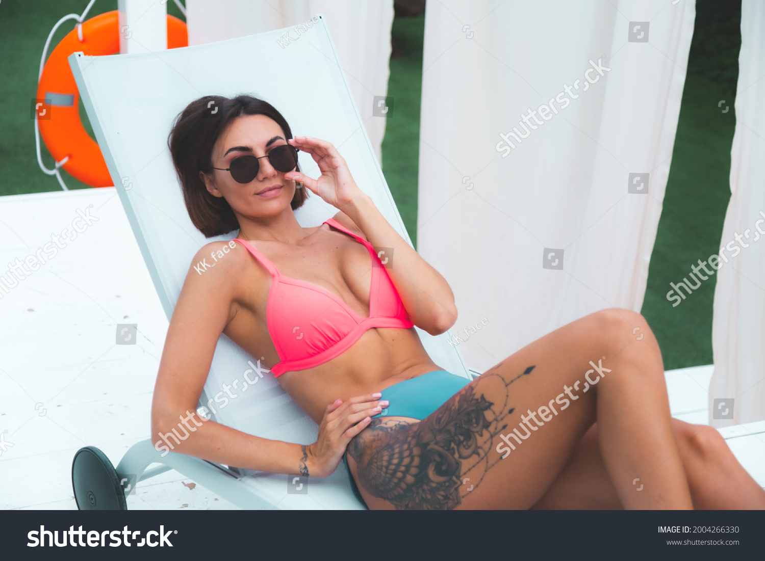 Beautiful Tanned Fit Woman Bikini Backyard Stock Photo