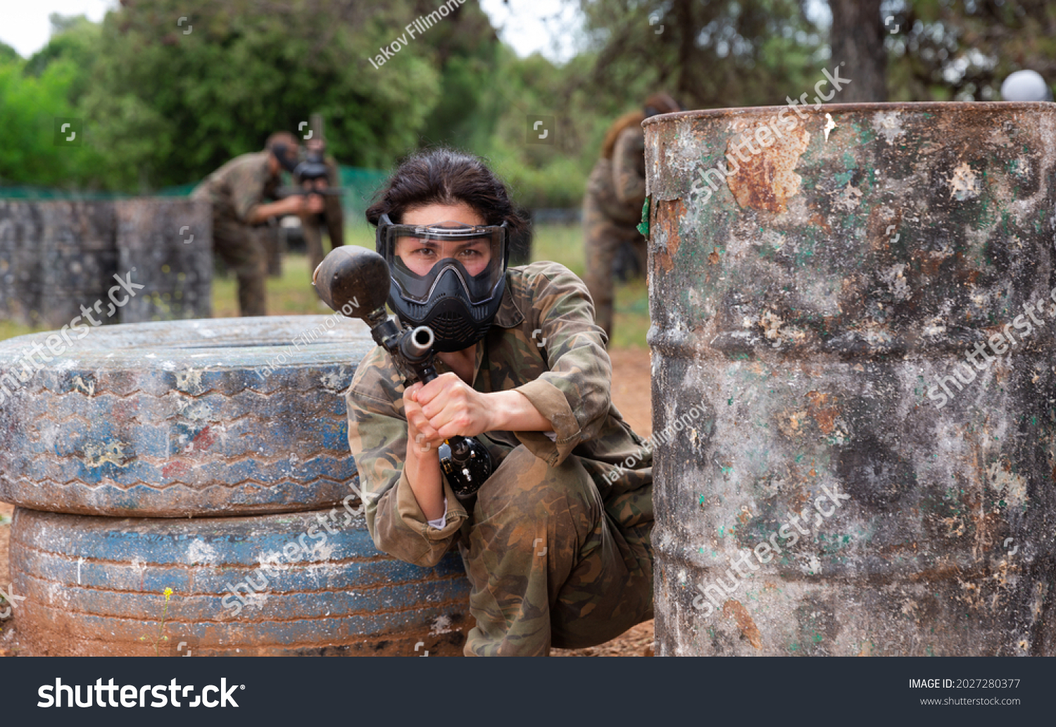 Female Paintball Player Aiming Shooting Gun Stock Photo 2027280377