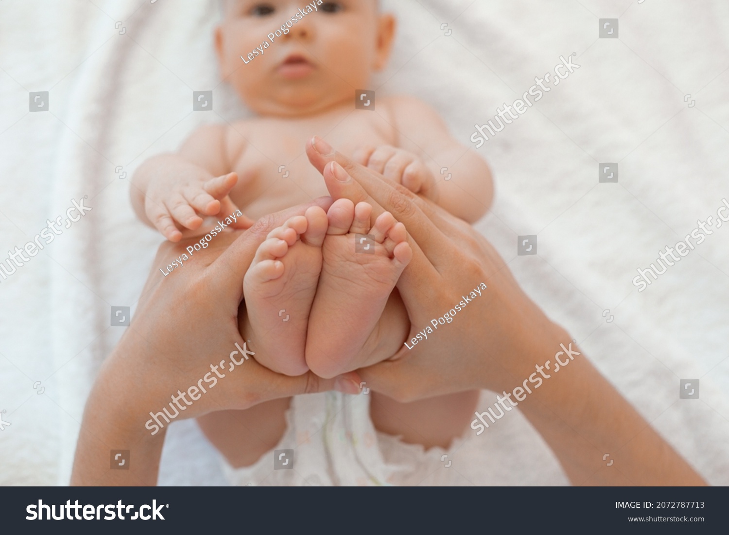 Hands Hold Babys Legs Stock Photo Shutterstock