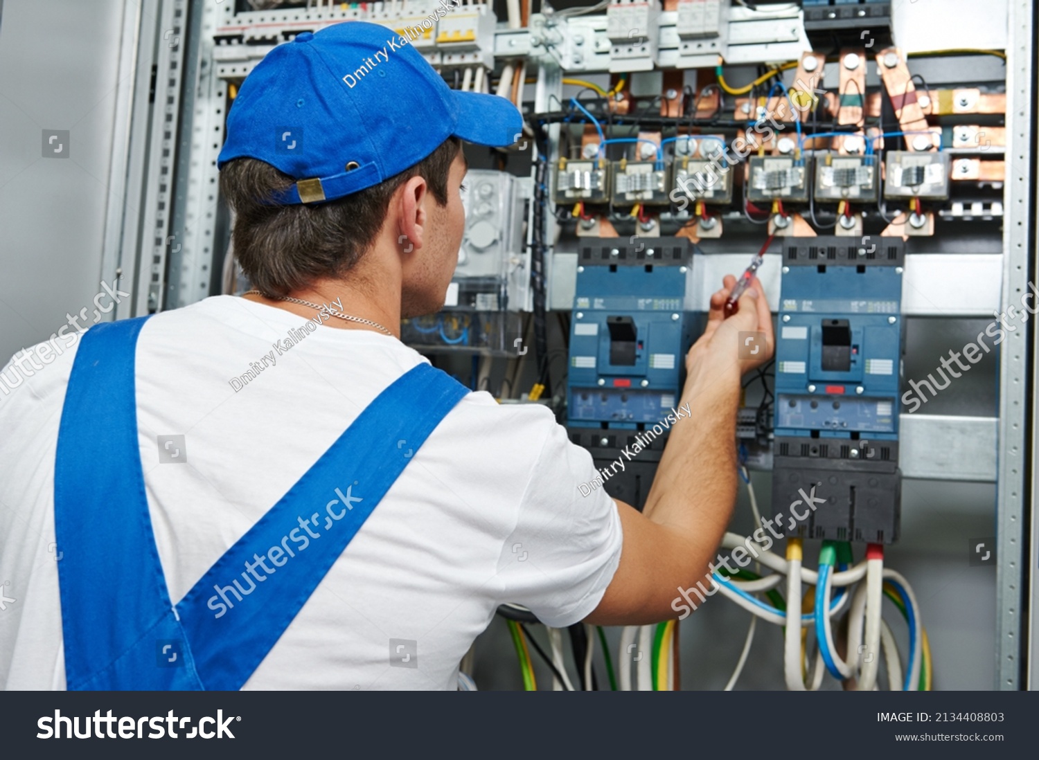 Electrician Engineer Worker Checks Electrical Equipment Stock Photo