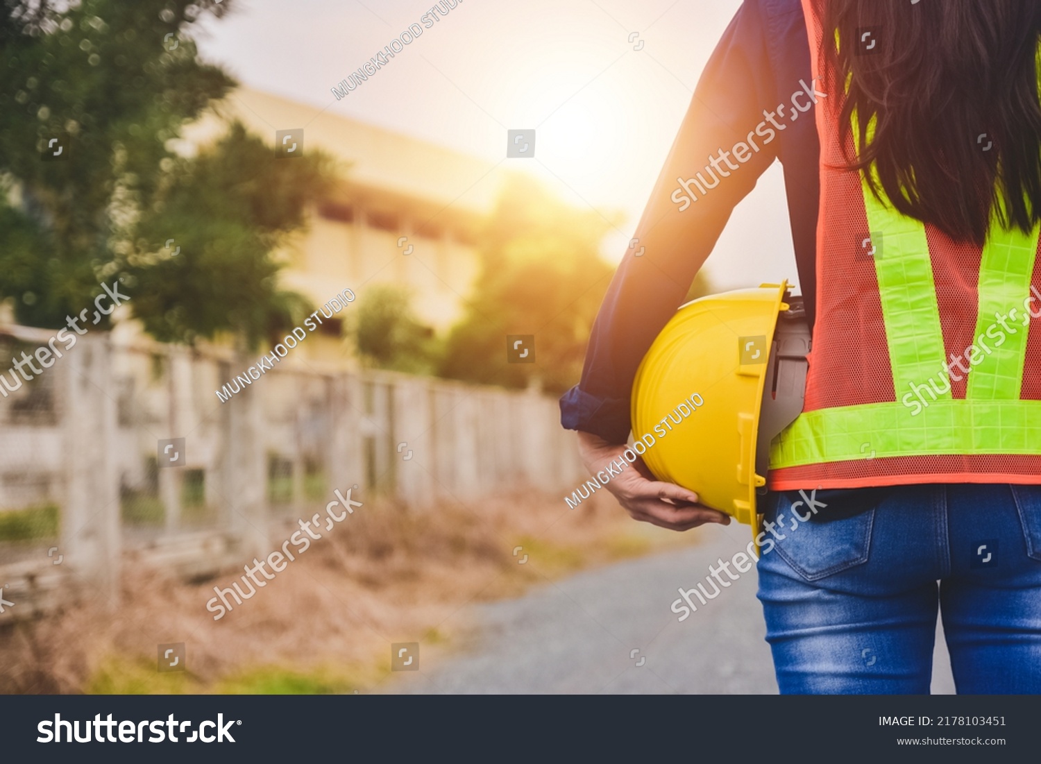 Women Engineer Holding Safety Helmet On Stock Photo 2178103451