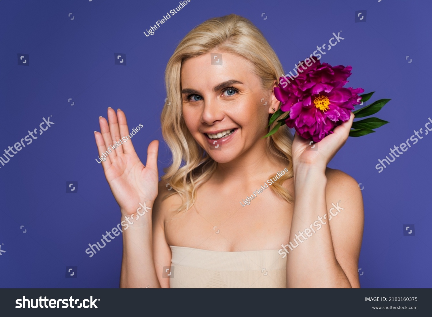 Happy Blonde Woman Bare Shoulders Holding Stock Photo 2180160375