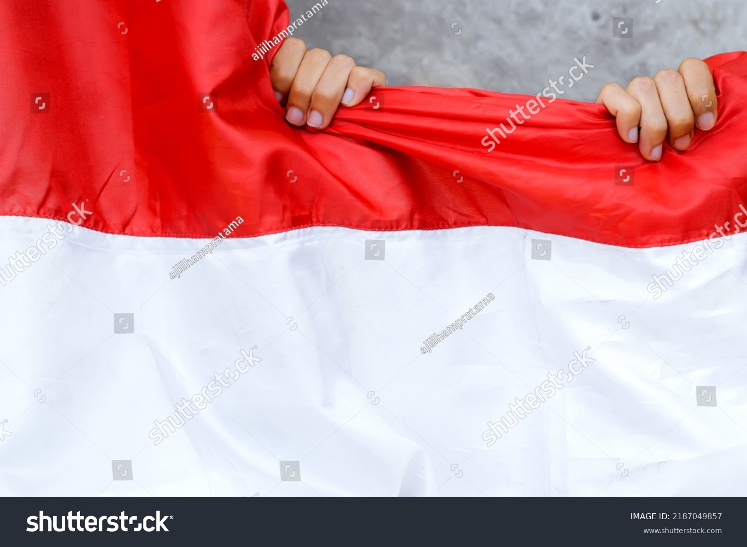 Person Holding Indonesian National Flag Indonesian Stock Photo