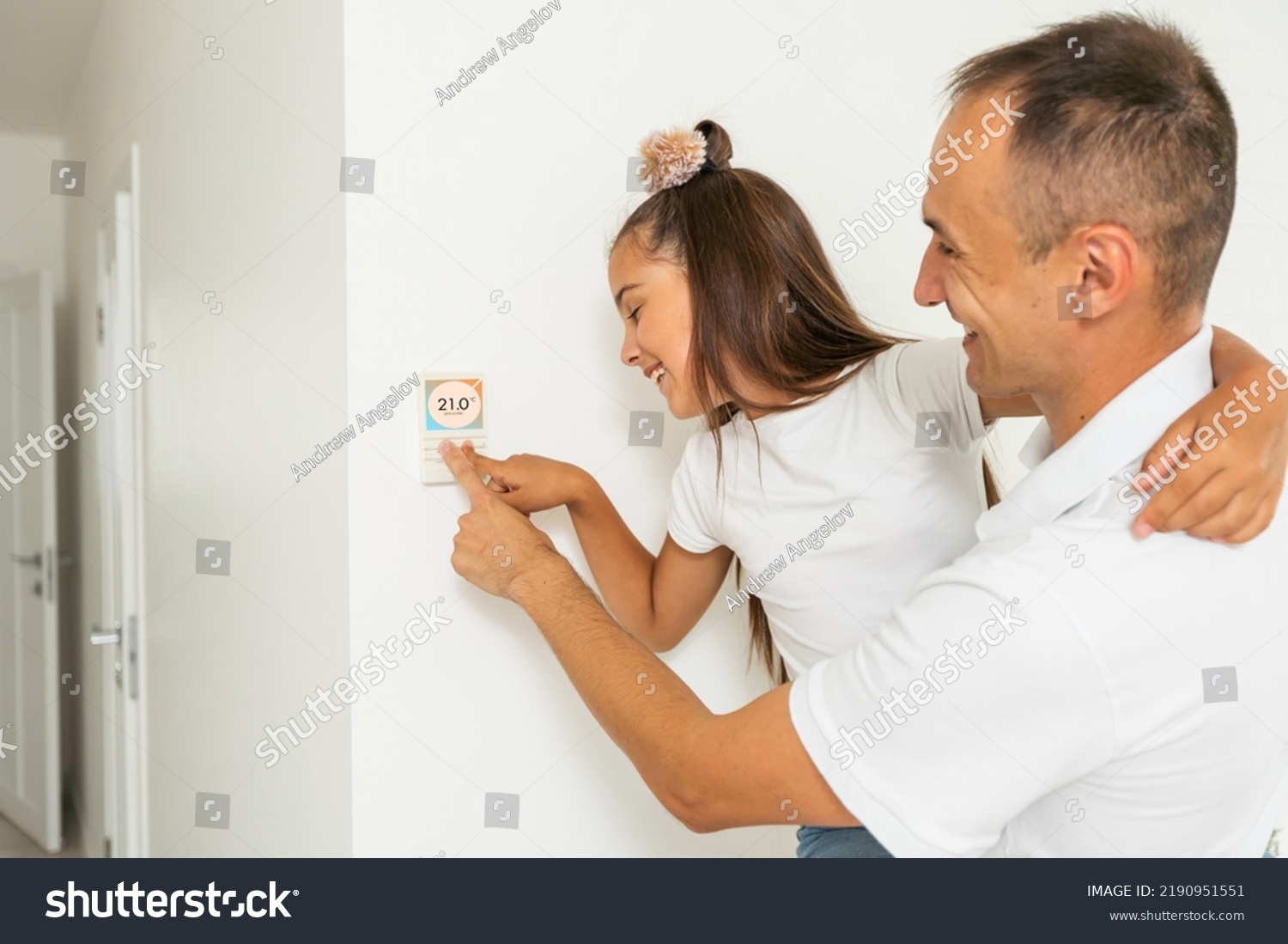 Man Hand Adjusting Temperature Thermostat Stock Photo