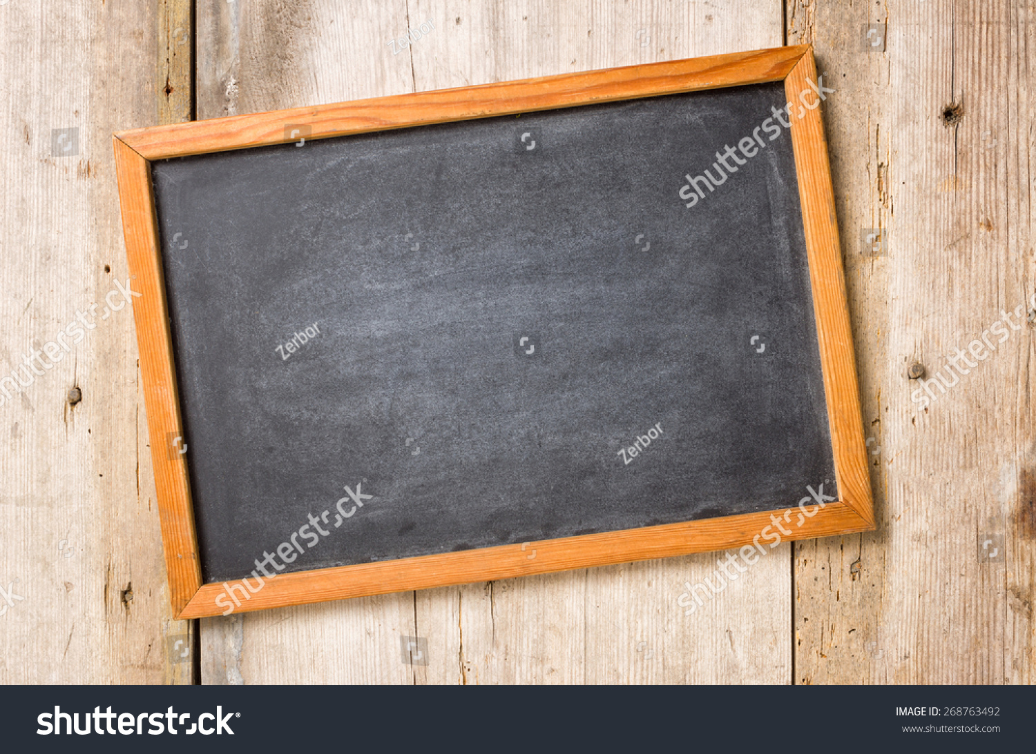 Empty Blackboard On Rustic Wooden Background Stock Photo