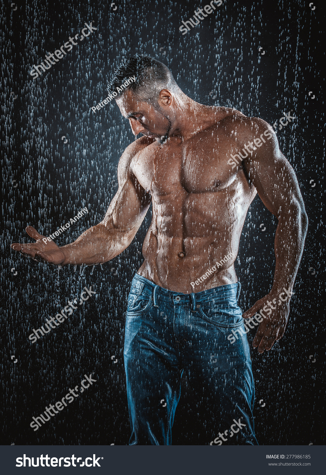 Very Muscular Handsome Athletic Man Rain Stock Photo