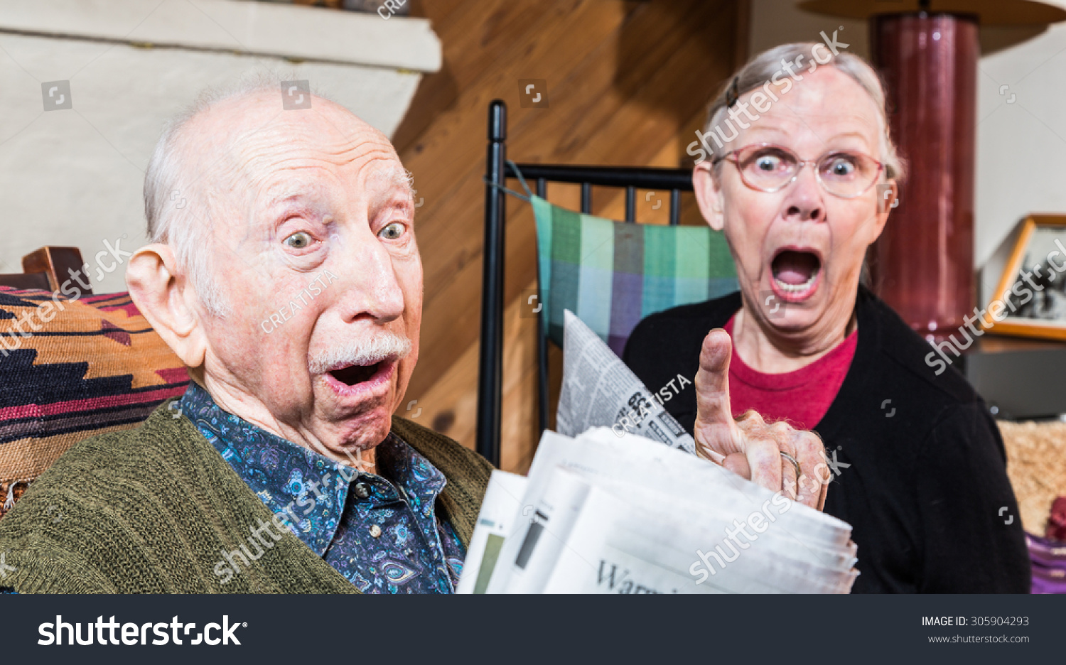 Angry Older Couple Reading Newspaper Livingroom Stock Photo