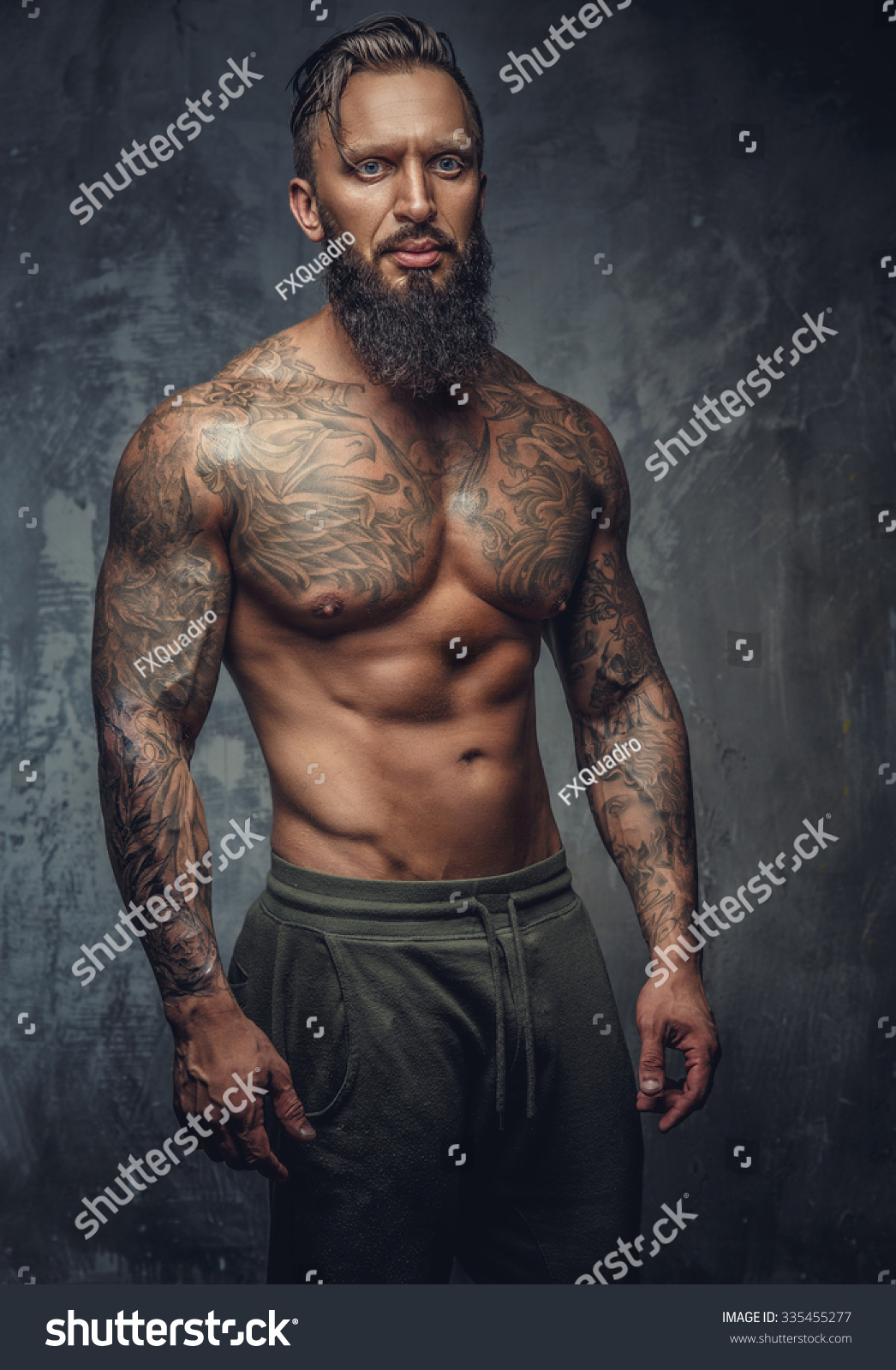 Tattooed Muscular Man Beard Stripes Panties Stock Photo