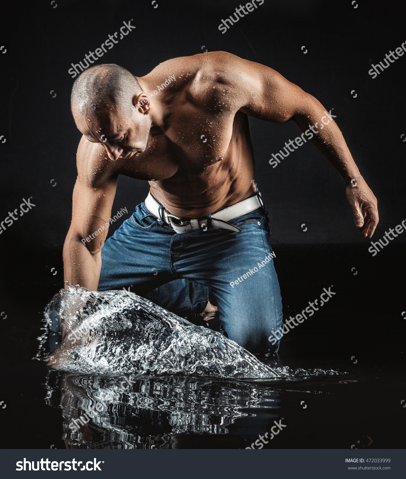 Very Muscular Handsome Athletic Man Striking Stock Photo