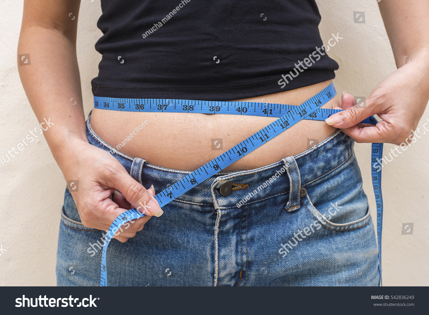 Overweight Woman Tape Measure Around Waist Stock Photo