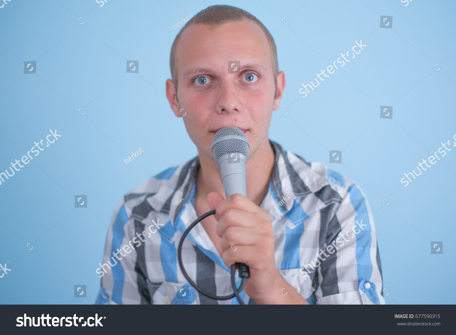 Hand Holding Microphone Conducting Business Interview Stock Photo