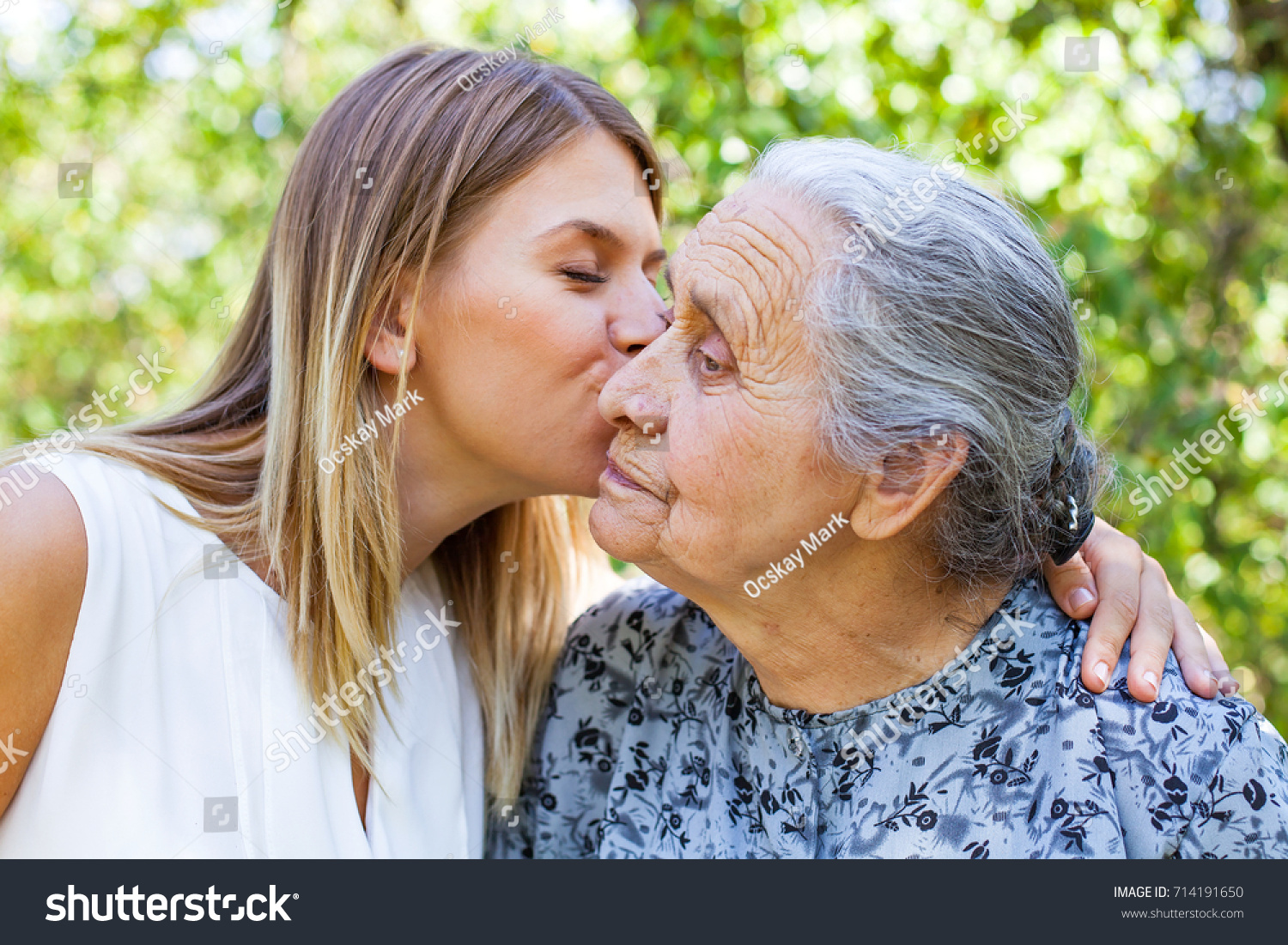 Kiss old woman photo