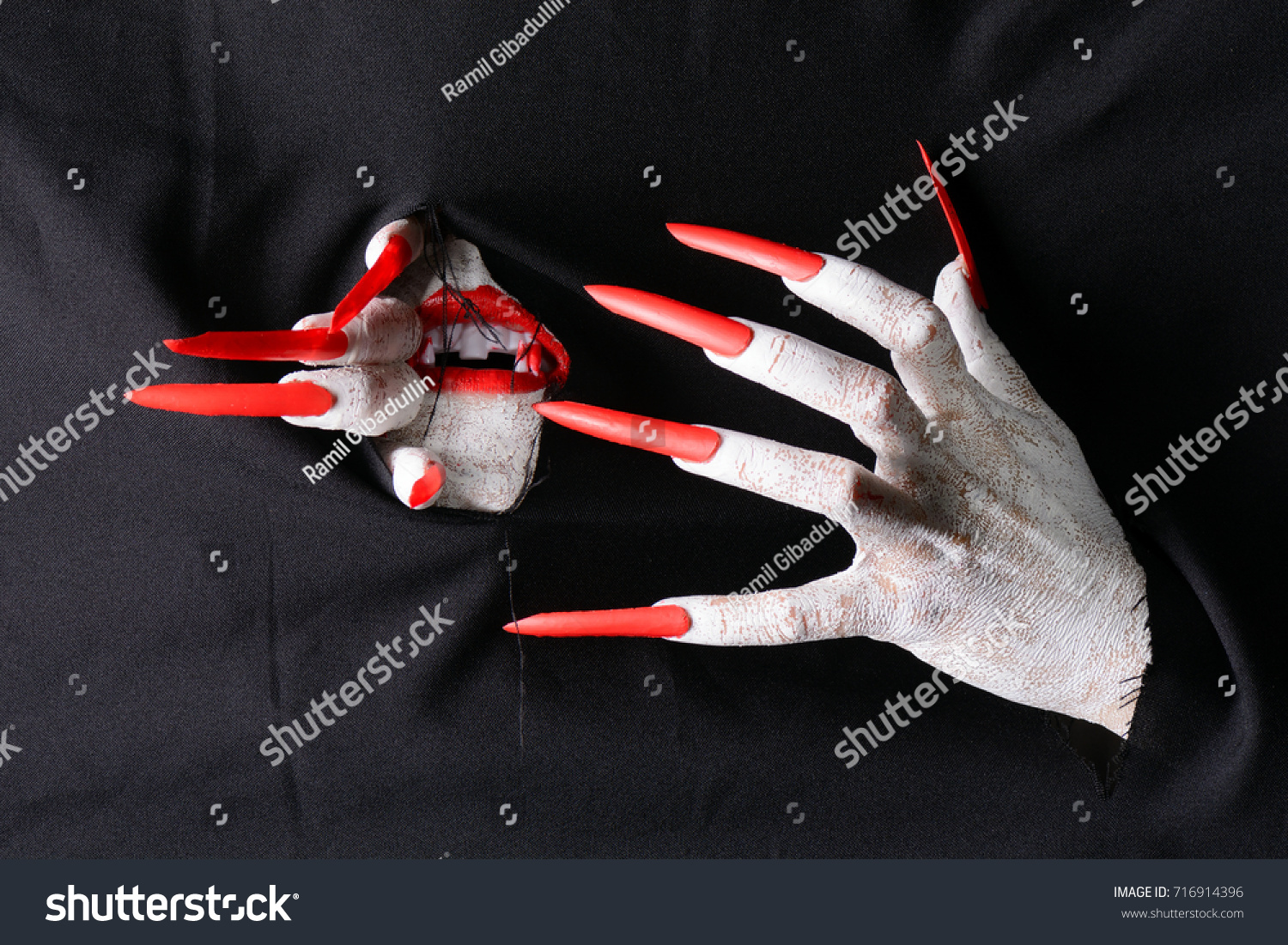 Horrifying Vampire Tearing Hole Through Black Stock Photo