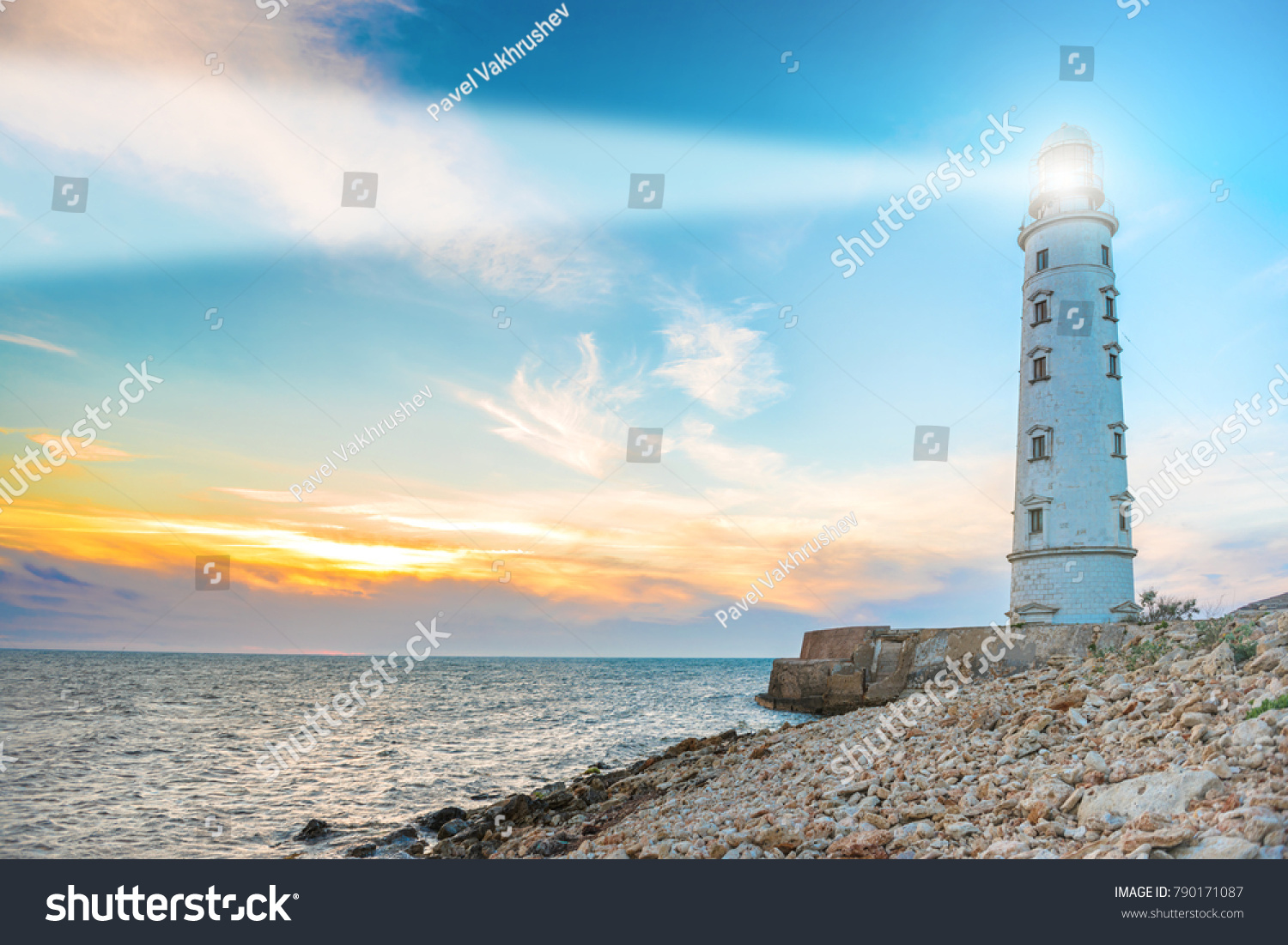 Lighthouse Searchlight Beam Through Sea Air Stock Photo