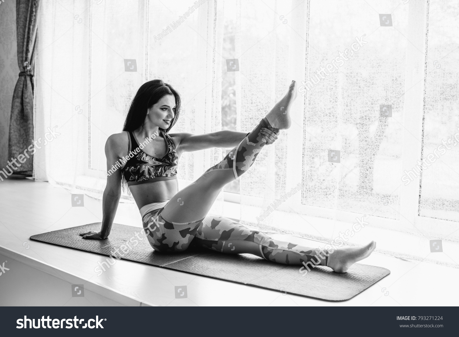 Sexy Fitness Athlete Performs Exercises On Stock Photo