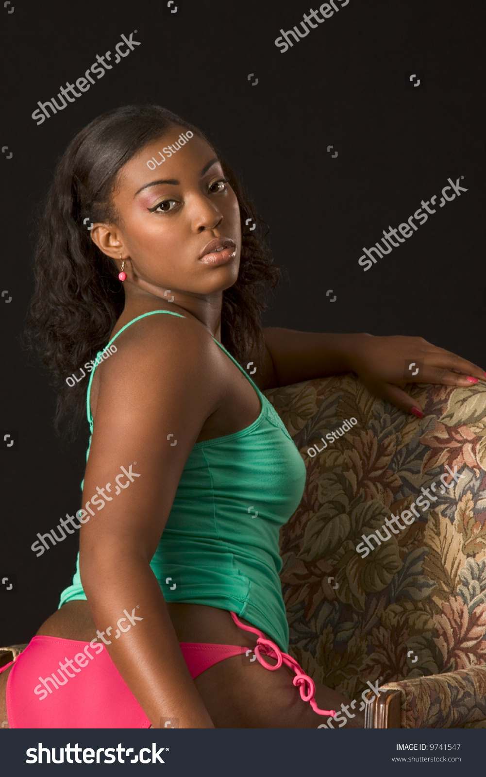 Glamorous Black Girl Lingerie Sitting Chair Stock Photo