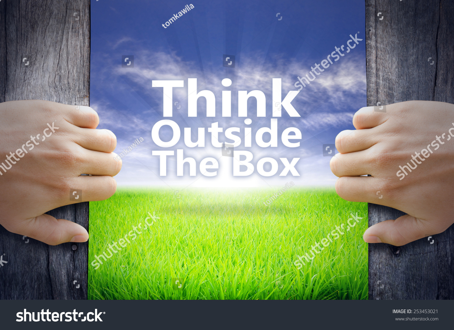 "Think Outside The Box" Motivational Quotes. Hands Opening A Wooden