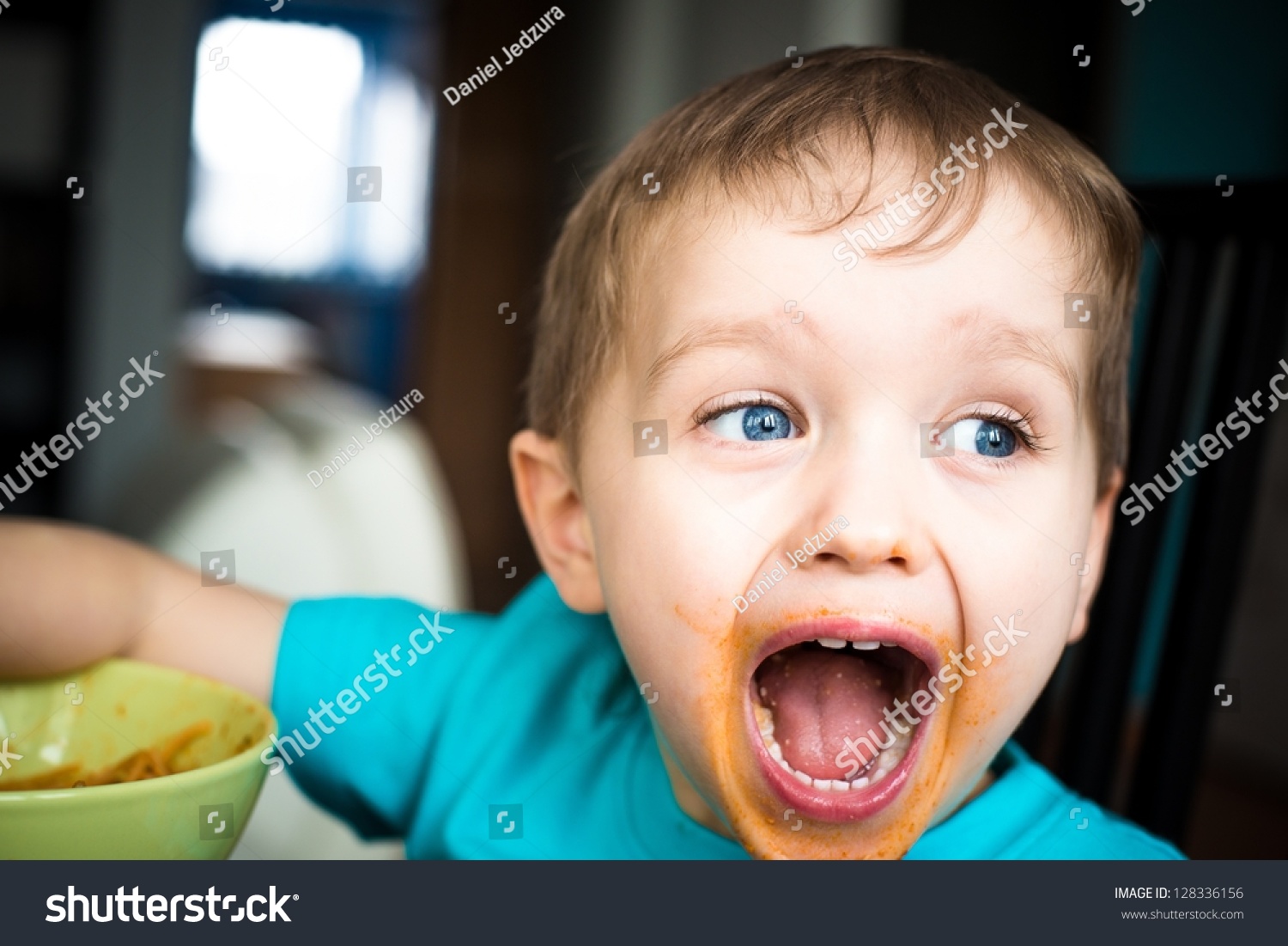 3-year-old-boy-cries-while-eating-dinner-stock-photo-128336156