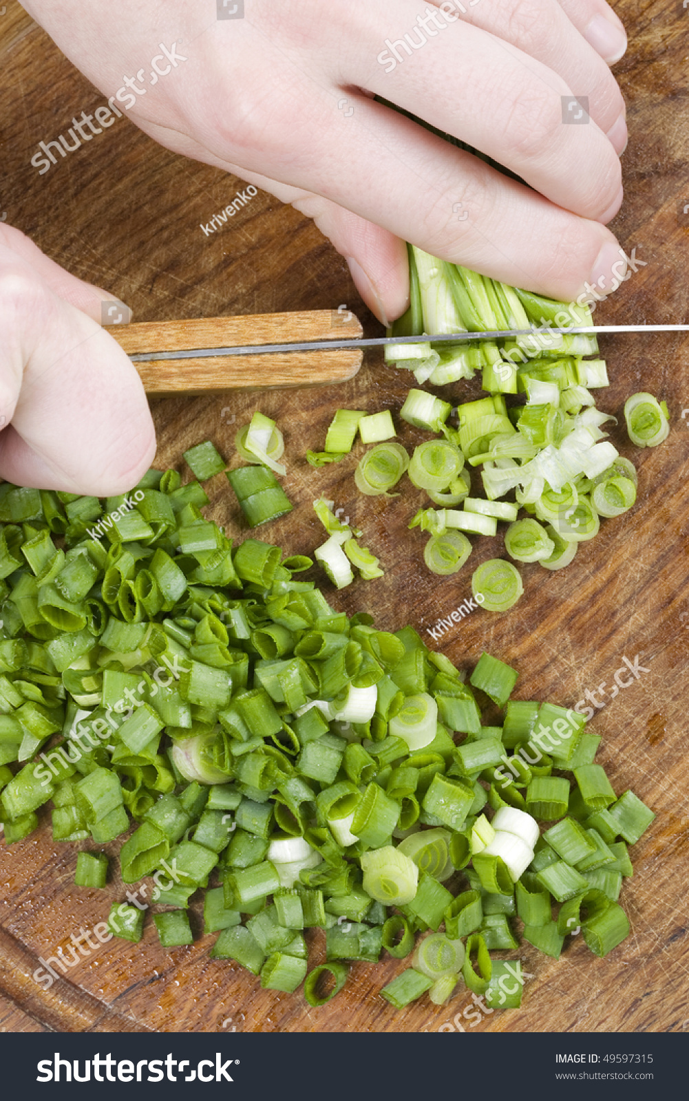 A Chopped Green Onions On A Wooden Chopping Board With A Knife. Stock Photo 49597315 Shutterstock