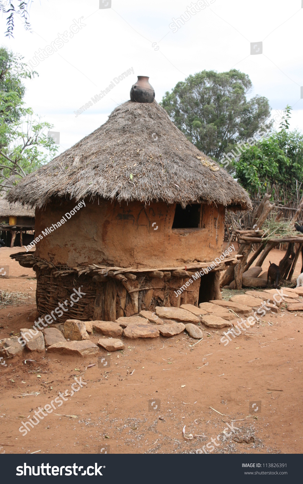 [Image: stock-photo-a-clay-and-thatched-roof-hut...826391.jpg]
