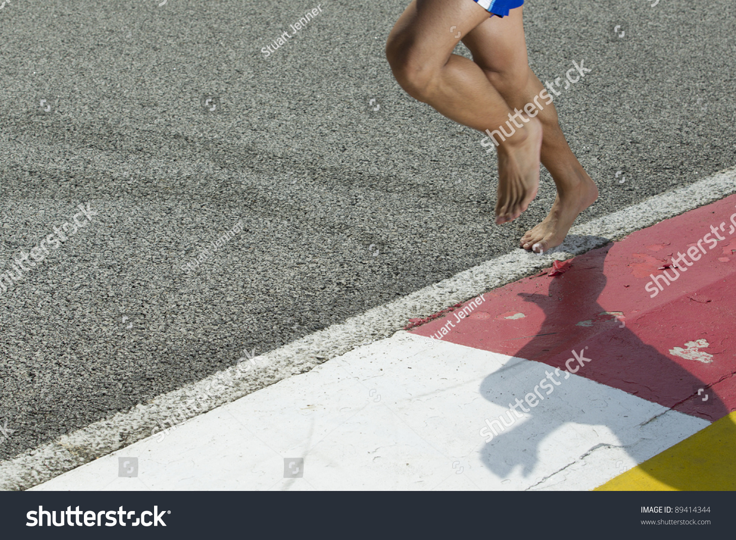 A Closeup Of A Runners Feet While Barefoot Running On A Track Stock Photo Shutterstock