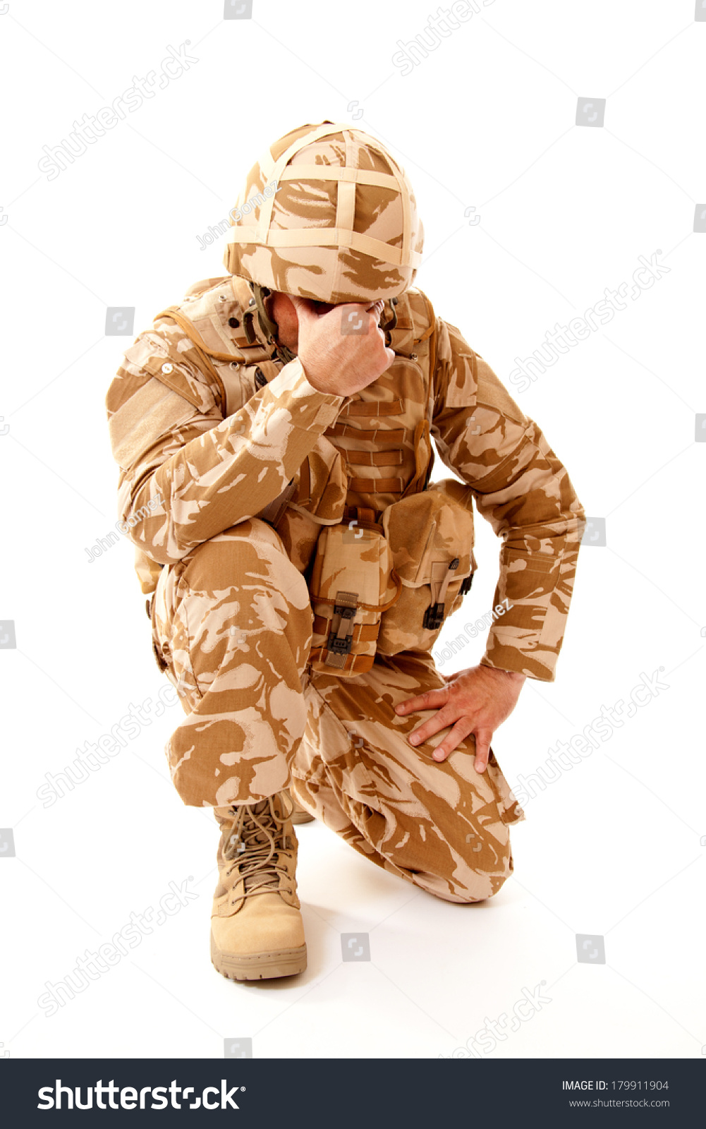 stock-photo-a-distraught-soldier-on-one-knee-with-one-hand-covering-his-face-possibly-suffering-from-shell-179911904.jpg