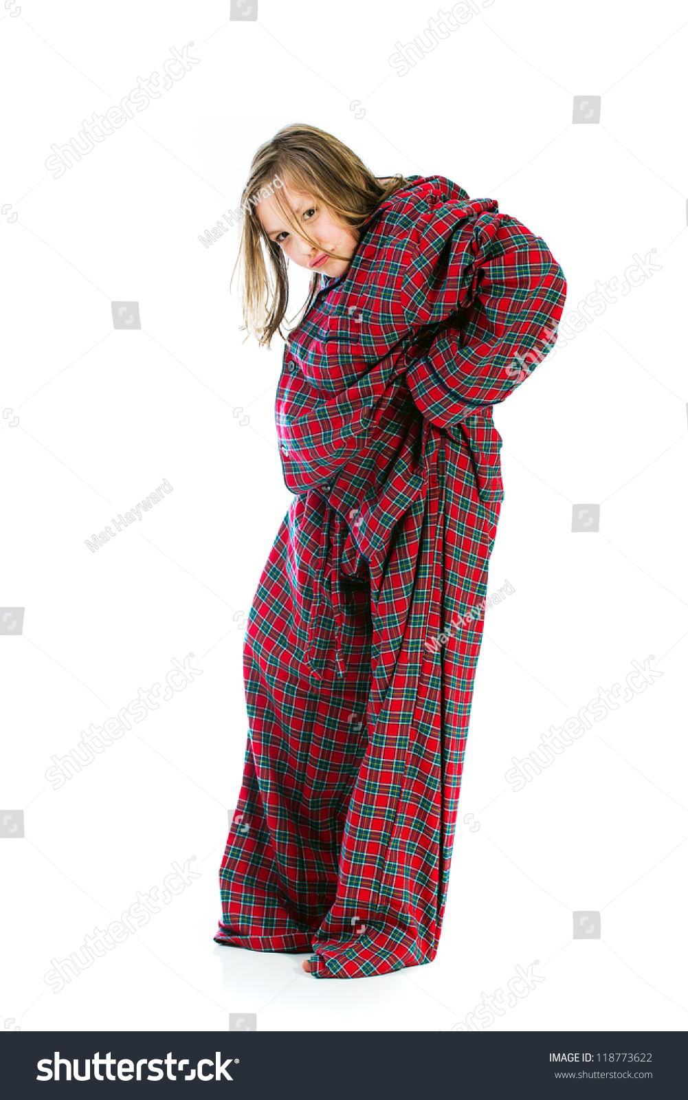 A Funny Young Girl Wearing Giant Oversized Pajamas Stock Photo