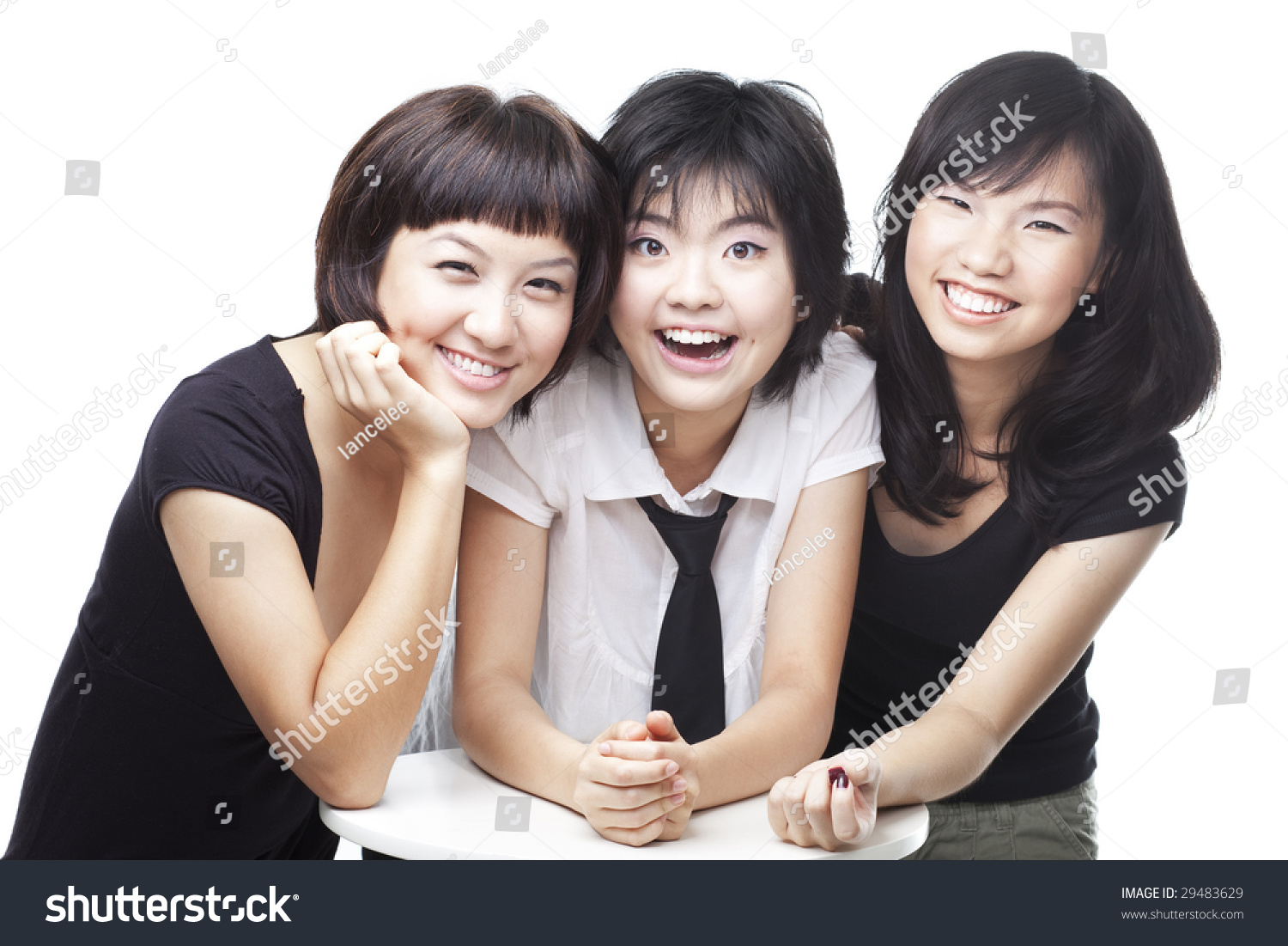 A Group Of Three Asian Chinese Teenagers Friends In College Sharing A 