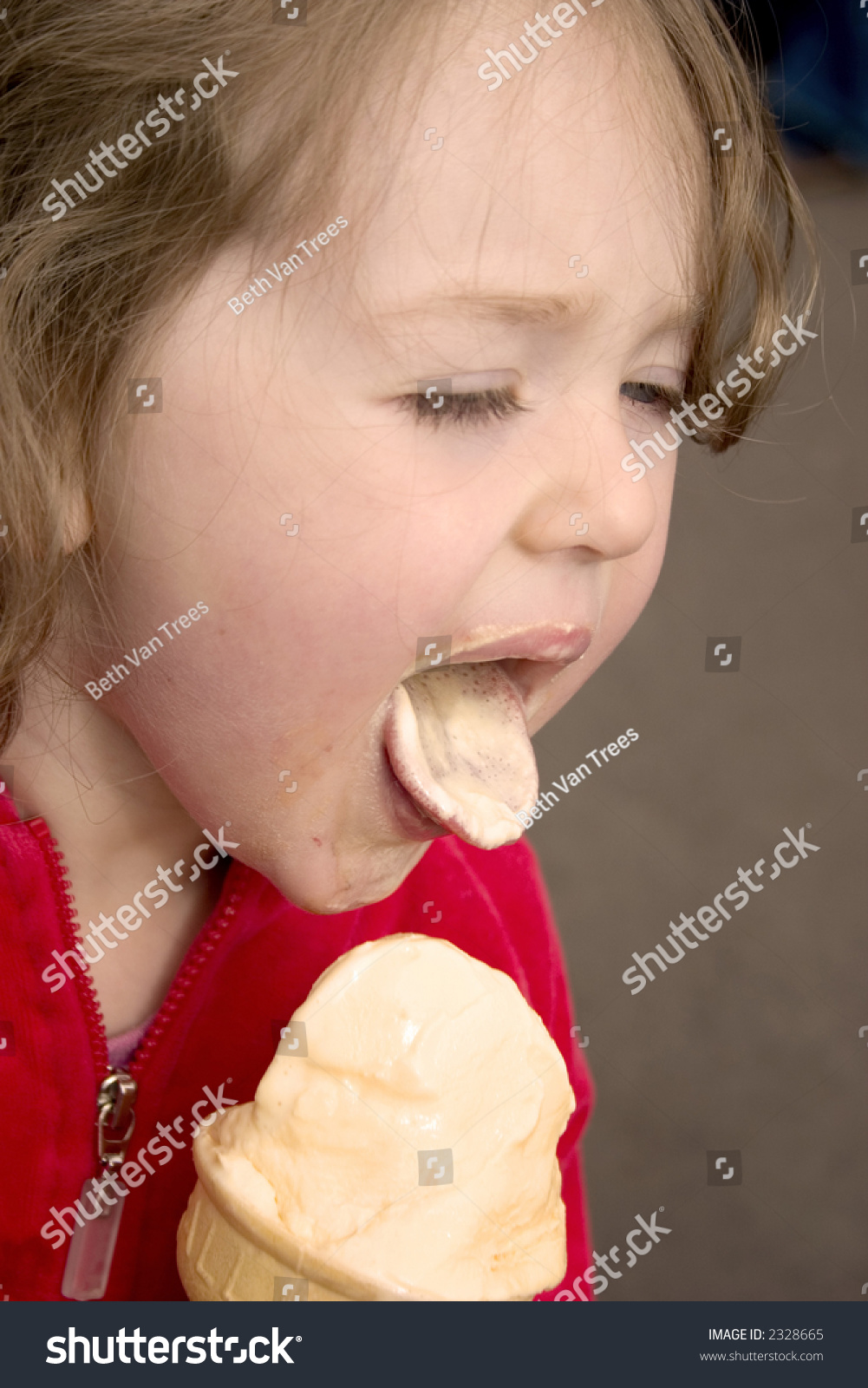 Little Girl Licking Ice Cream Con