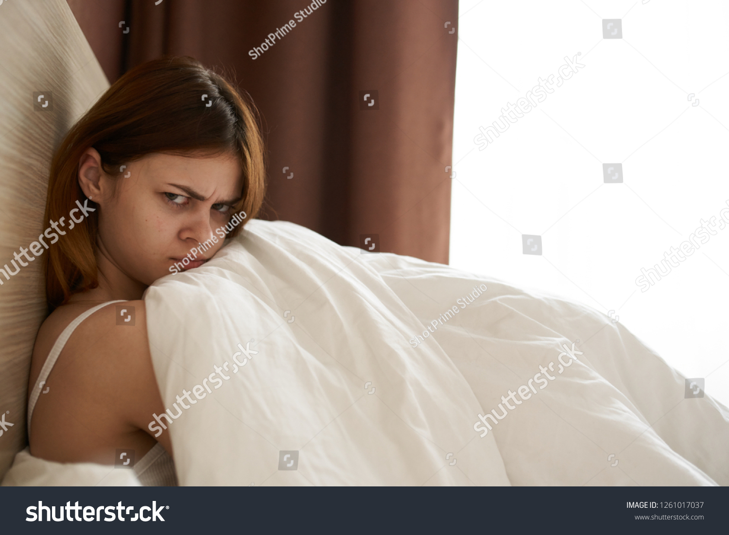 Sad Woman Lying Bed Under Blanket Stock Photo 1261017037 Shutterstock