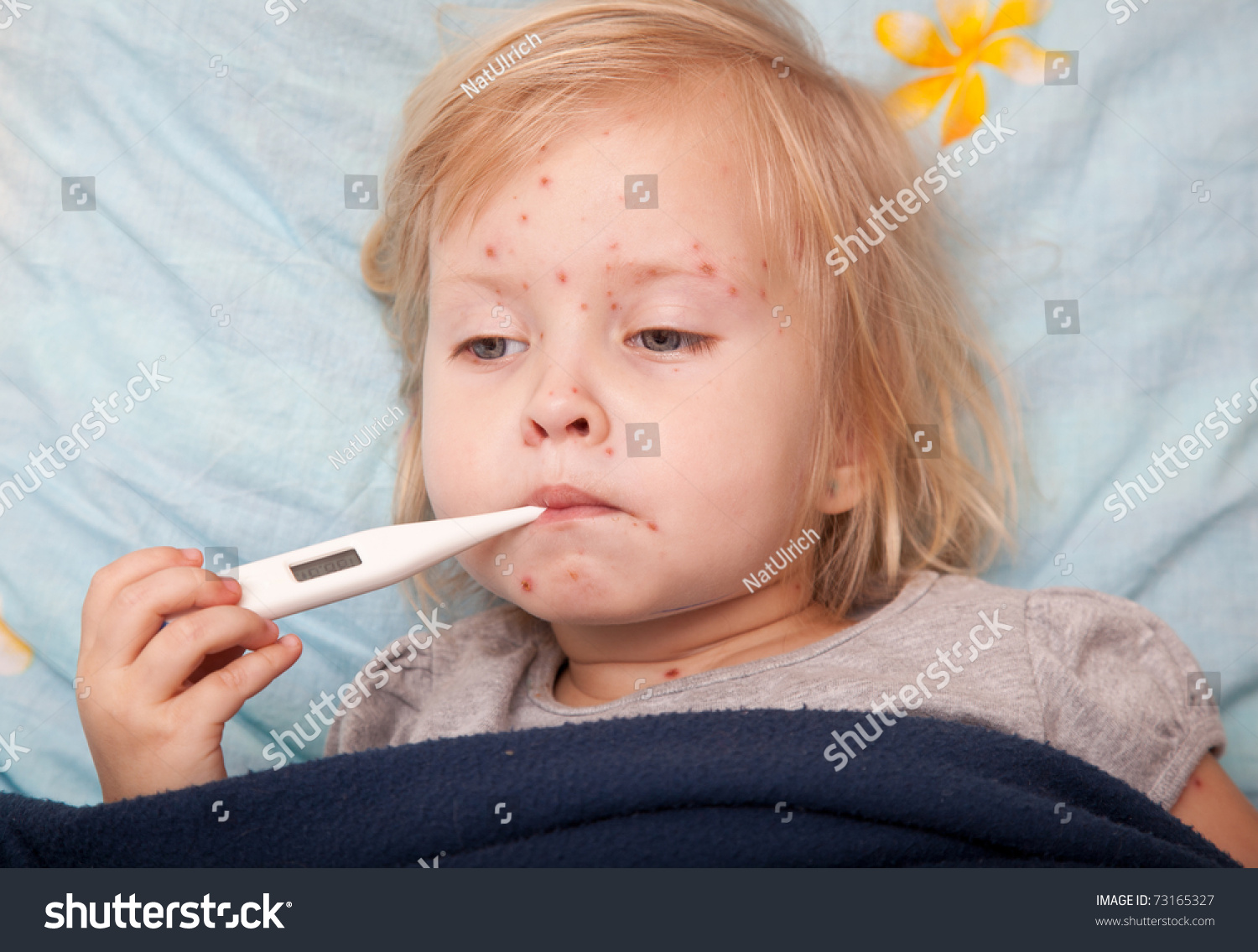 http://image.shutterstock.com/z/stock-photo-a-sick-cute-girl-is-measuring-the-temperature-73165327.jpg