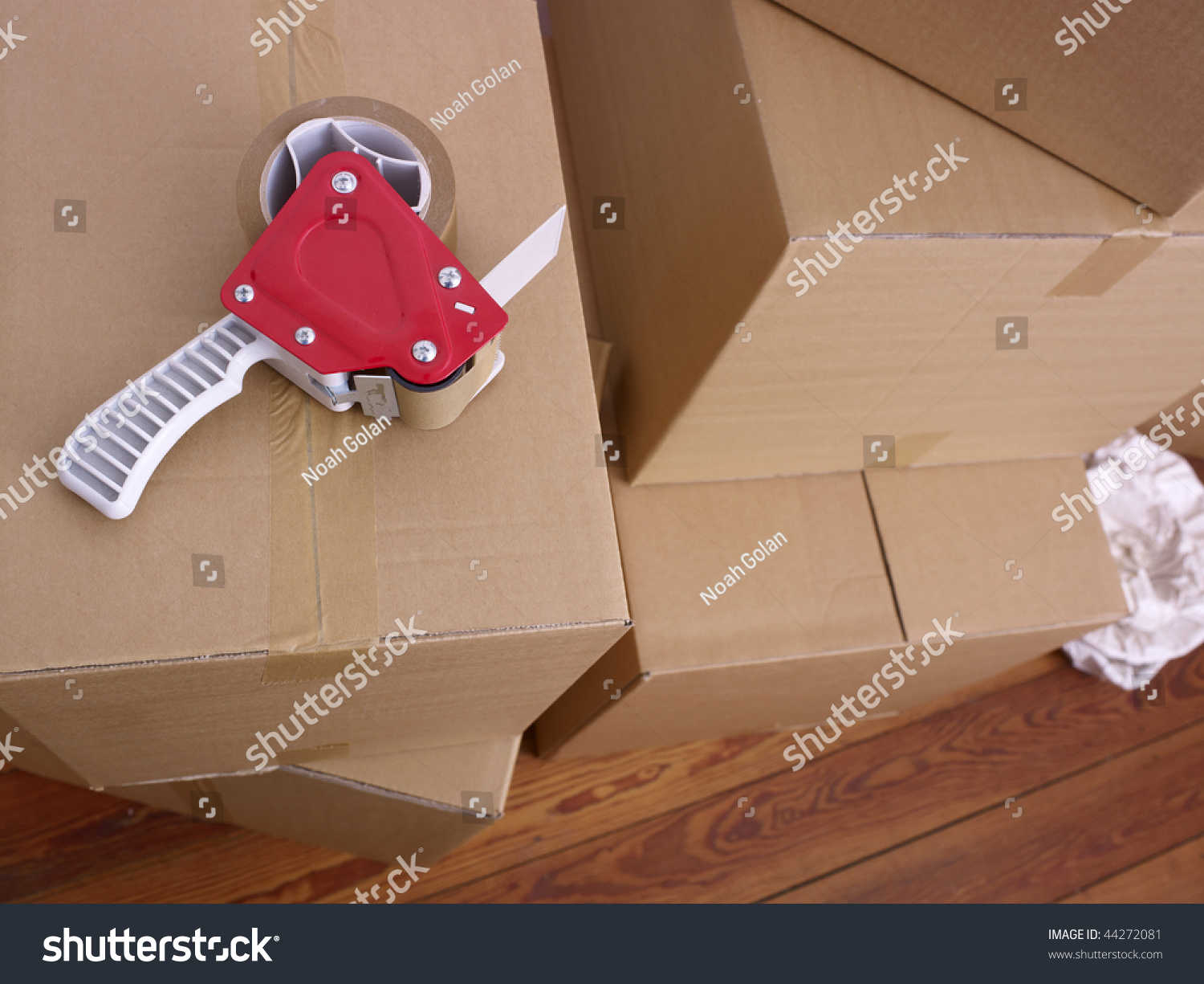 A Stack Of Cardboard Boxes And Packing Tape Stock Photo 44272081