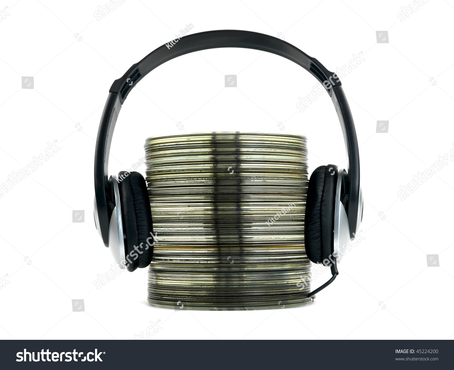 A Stack Of Compact Discs Isolated On A White Background A Stack Of Compact Discs And Headphones Isolated Against A