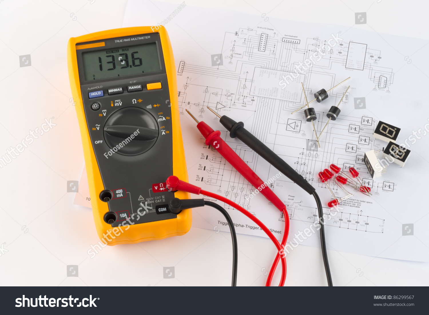 a-true-rms-multimeter-and-a-circuit-diagram-stock-photo-86299567