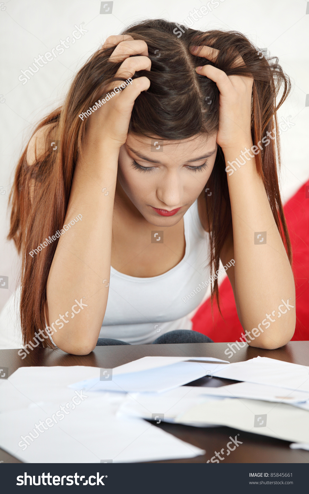 A Young Beautiful Woman Stressed Because Of Bills. Stock Photo 85845661