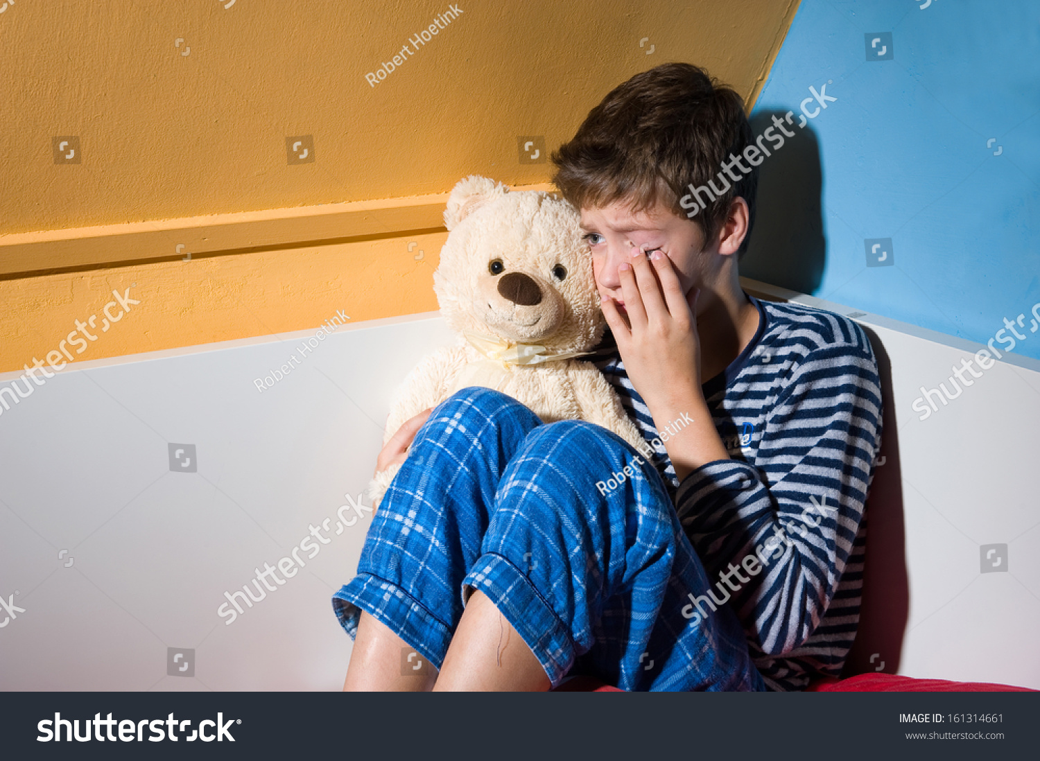 Young Boy Crying On His Bed Stock Photo 161314661 - Shutterstock