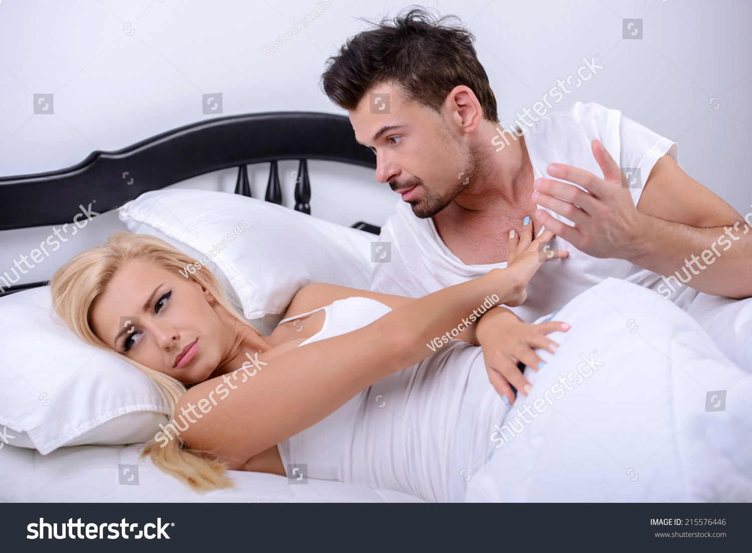 http://image.shutterstock.com/z/stock-photo-a-young-couple-quarreling-lying-in-bed-in-her-bedroom-215576446.jpg