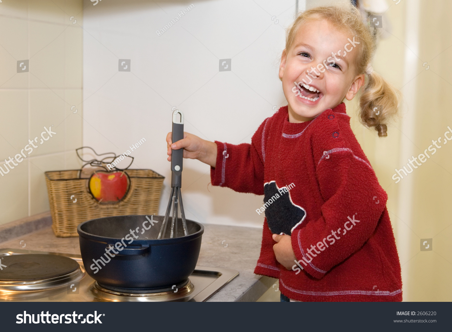 A Young Girl Cooking Stock Photo 2606220 : Shutterstock