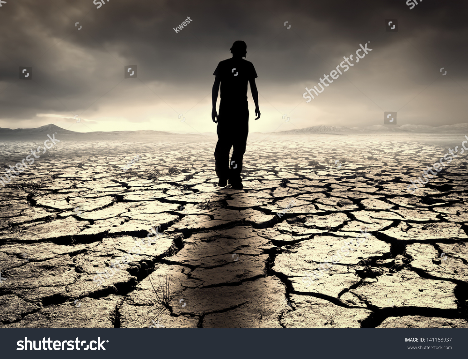 young-man-walks-into-desolate-desert-stock-photo-141168937-shutterstock