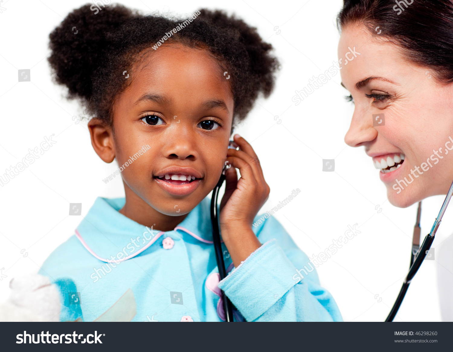 Adorable Little Girl And Her Doctor Playing With A Stethoscope At A