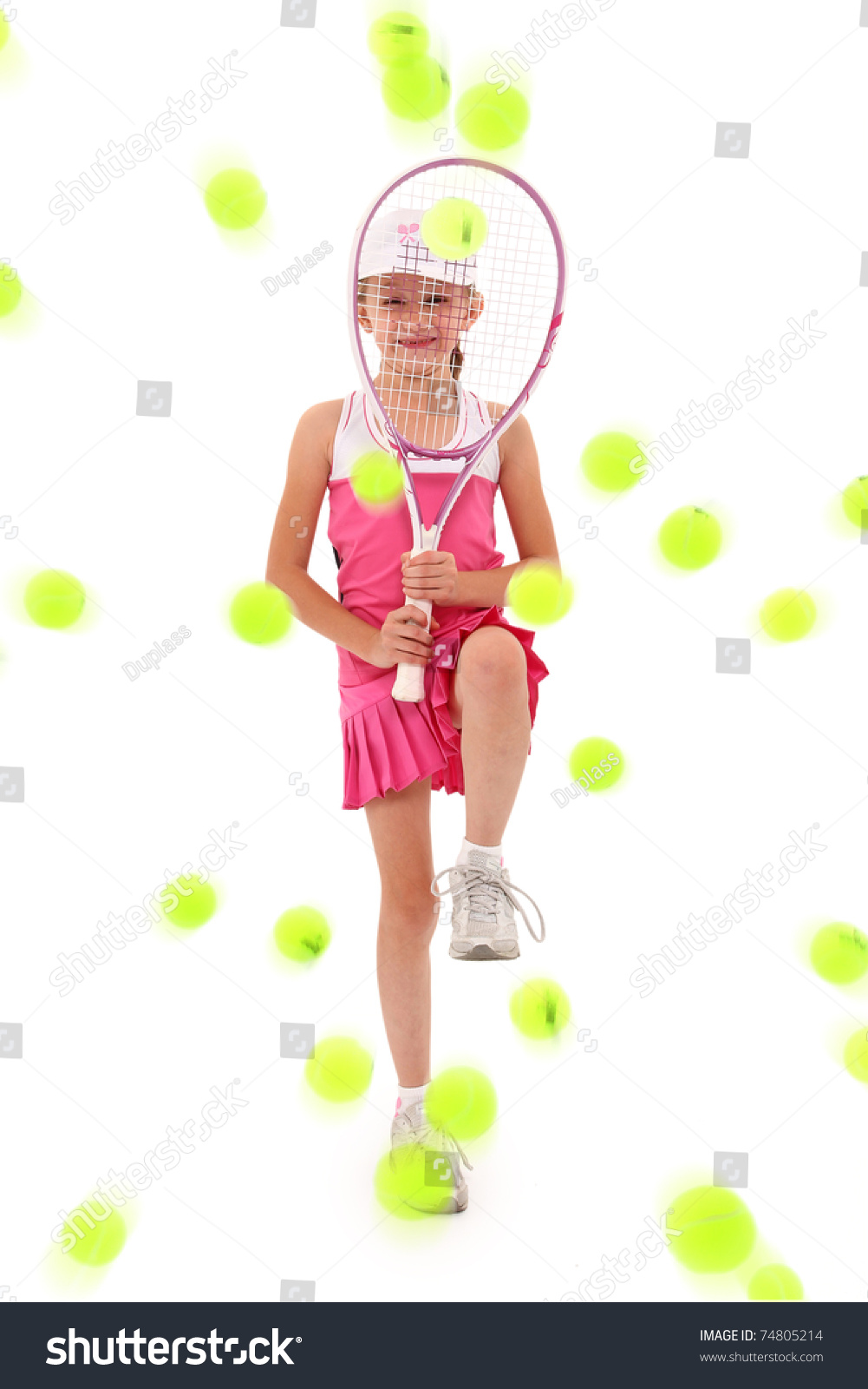 Adorable Seven Year Old Caucasian Girl In Tennis Uniform Defending Herself With Racquet Being