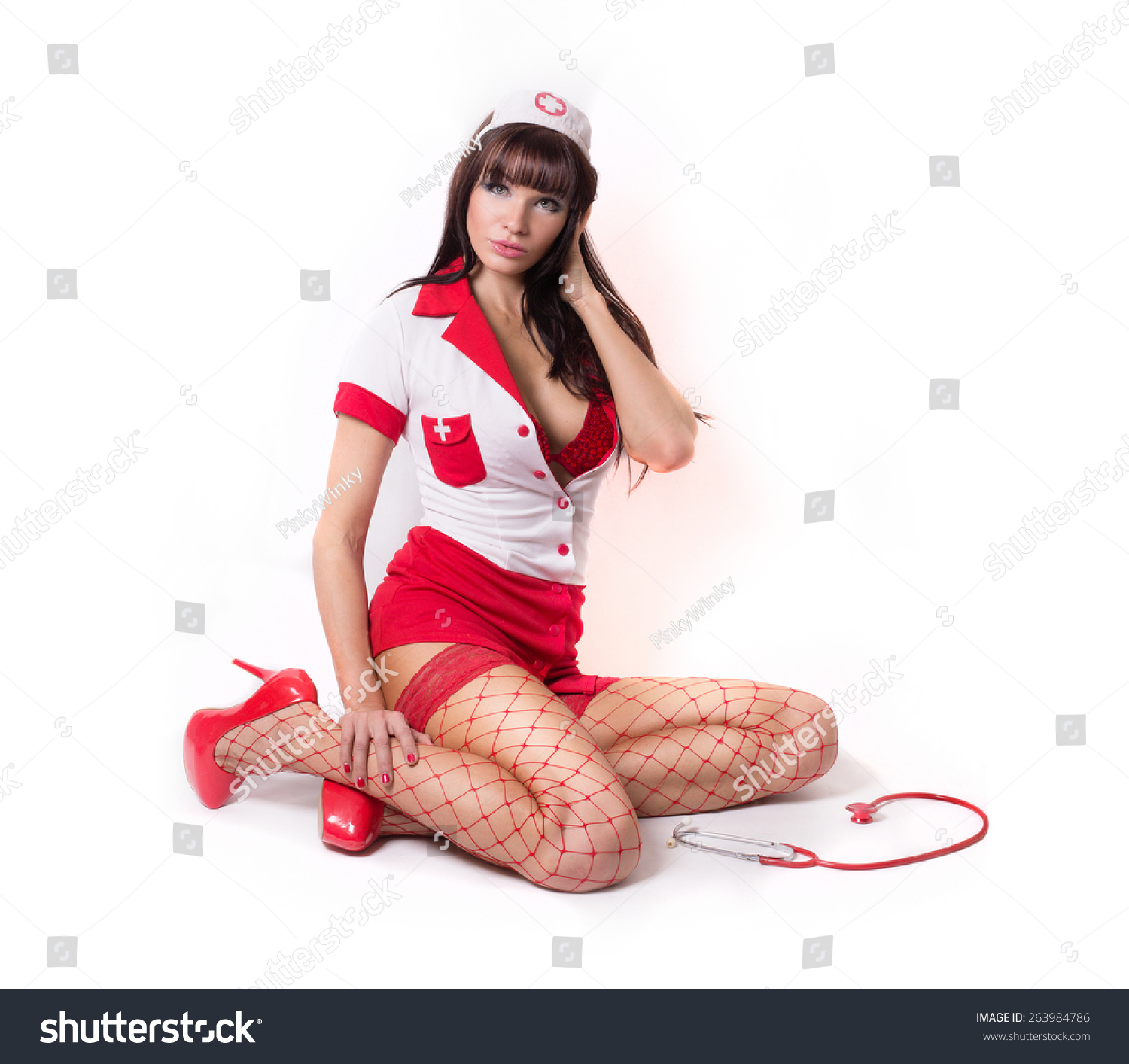 Adult Image Sexy Brunette In White And Red Costume Nurse With A