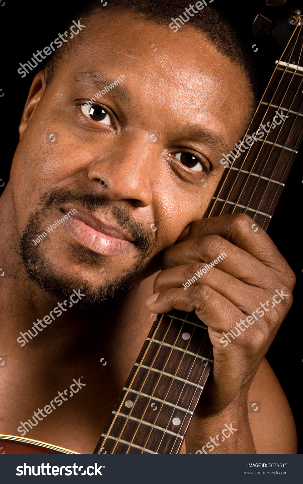 african-american-blues-singer-with-guitar-stock-photo-7679515