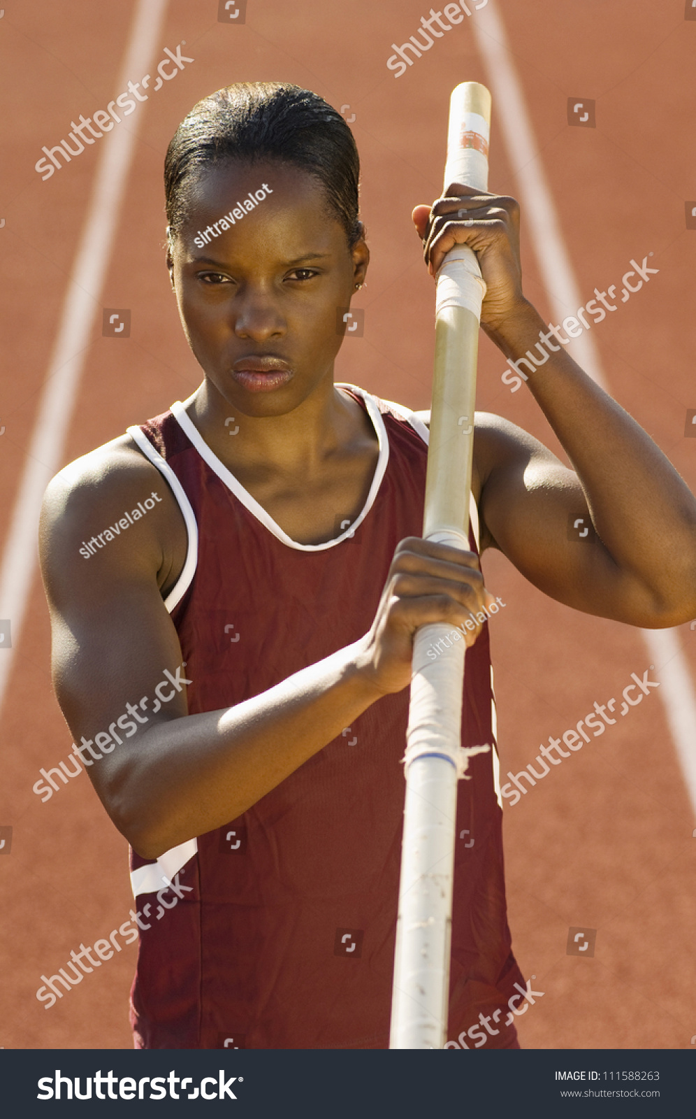 African American Female Pole Vaulter Holding Pole Stock Photo 111588263