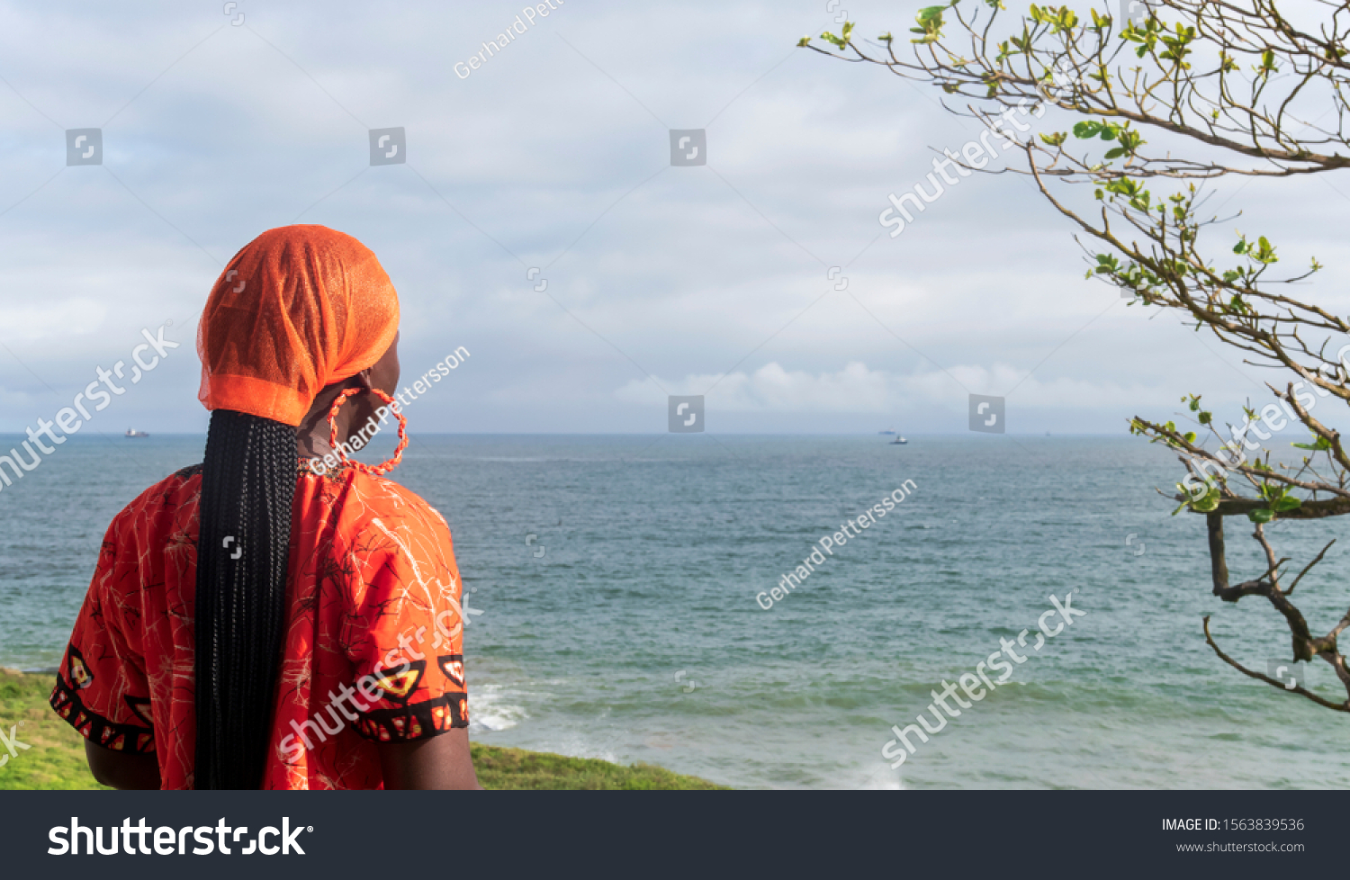 African Woman Wearing Orange Traditional Dress Stock Photo 1563839536