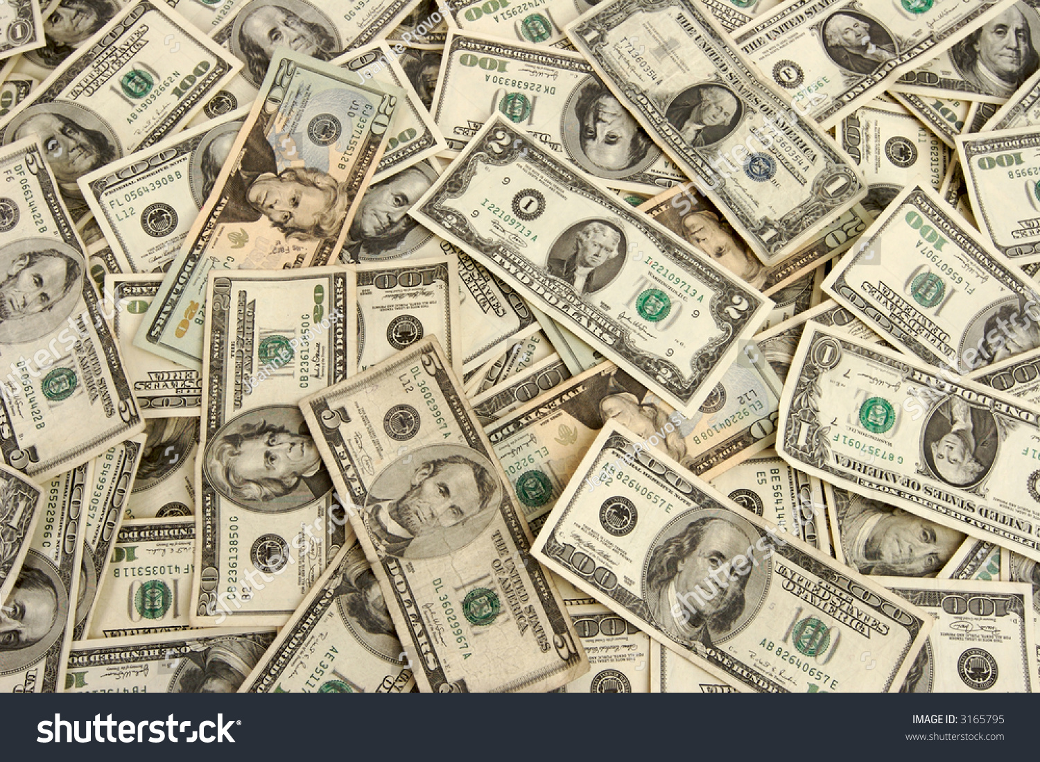 american-money-currency-in-assorted-bills-background-stock-photo