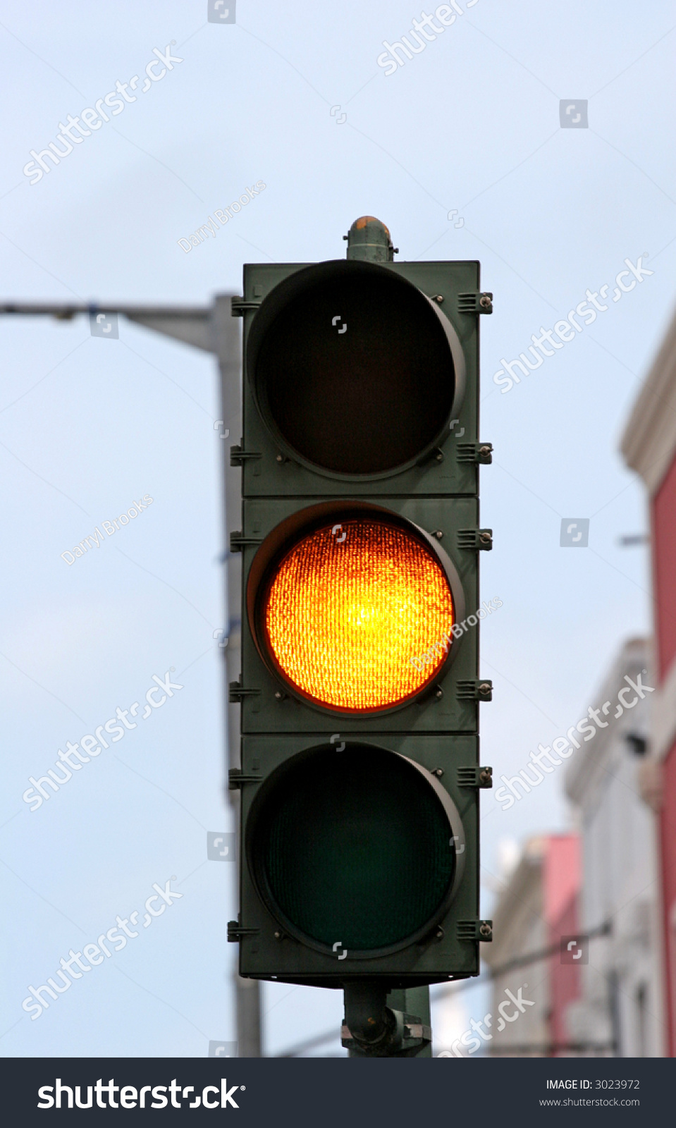 an-amber-caution-light-on-a-traffic-signal-stock-photo-3023972