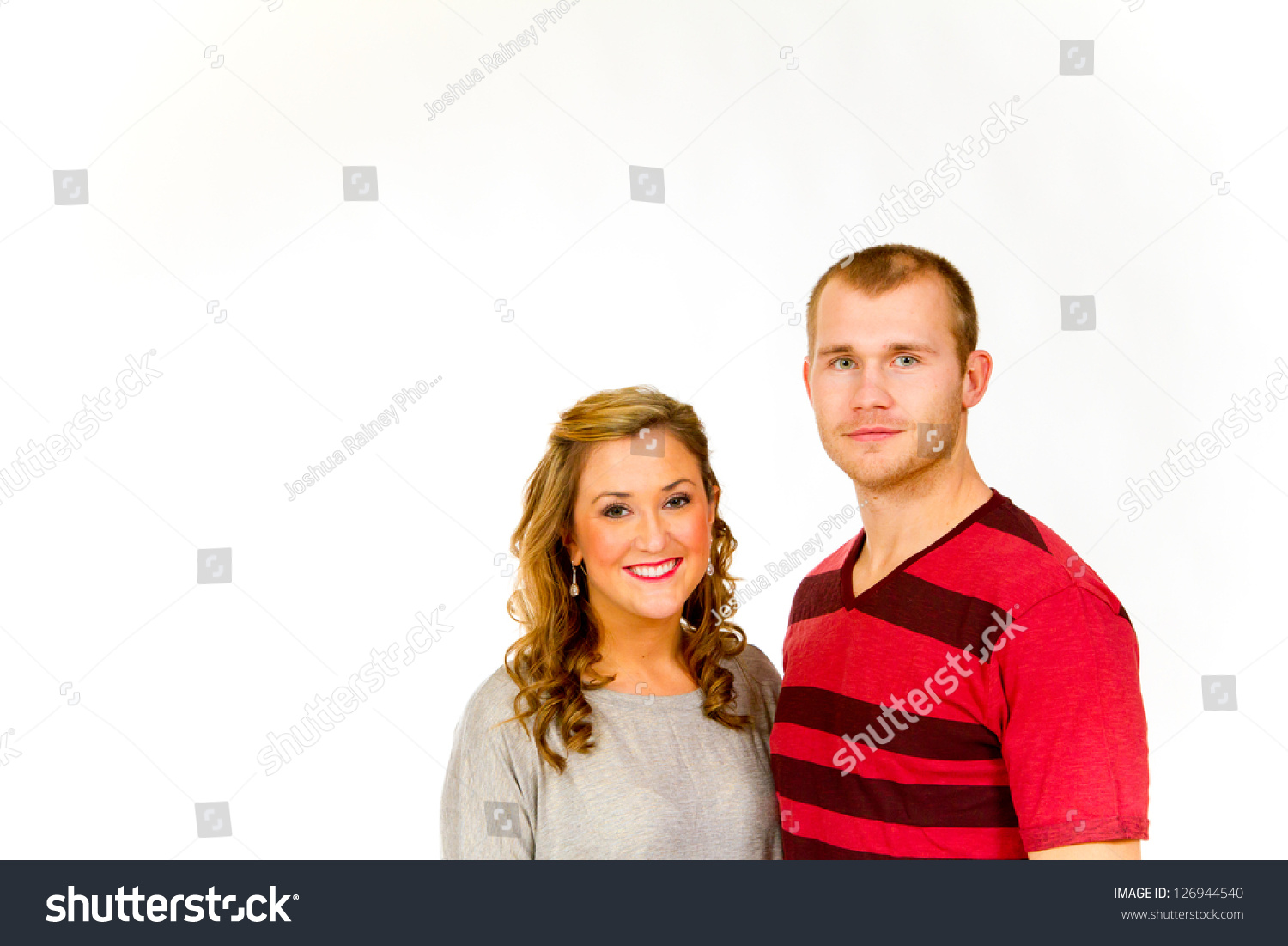 An Attractive Couple Against A White Background In The Studio To Create