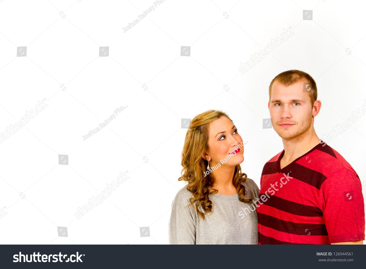 An Attractive Couple Against A White Background In The Studio To Create